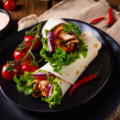 Tasty wraps filled with pulled pork and salad