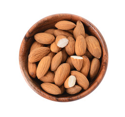 Bowl with tasty almonds on white background