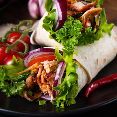 Tasty wraps filled with pulled pork and salad
