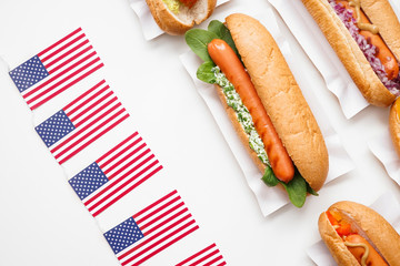 Tasty hot dogs on white background