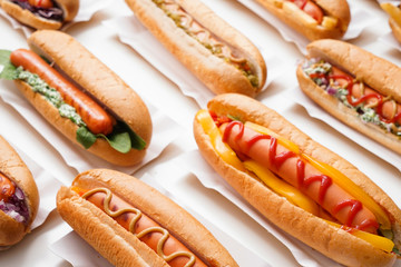Tasty hot dogs on white background