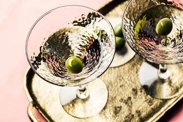 Martini cocktail with green olive