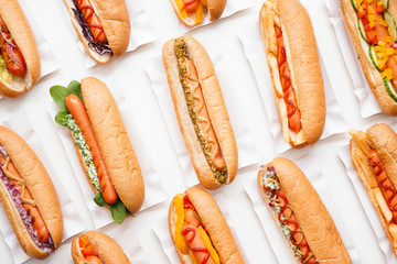 Tasty hot dogs on white background