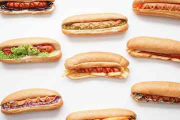 Tasty hot dogs on white background