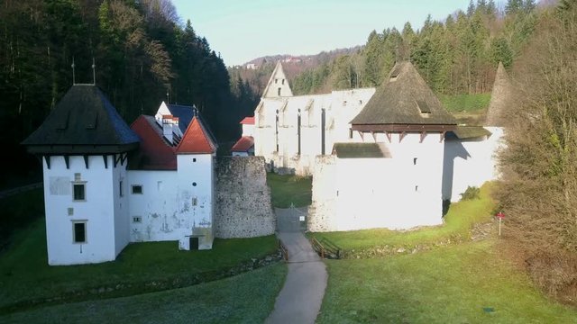 LOCE, SLOVENIA, 2019.01.25: Aerial: Flying over remainings of Zice monastery. Filming remainings of ancient French monastery Zicka kartuzija on beautiful sunny winter morning.