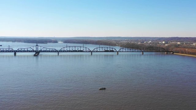 Aerial shot of a freight train crossing the Mississippi River at Davenport, Iowa.