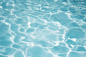 Fototapeta na wymiar Texture of water in swimming pool for background