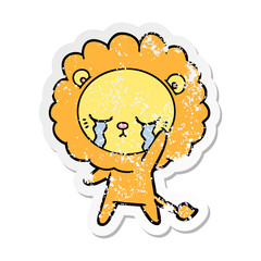 distressed sticker of a crying cartoon lion