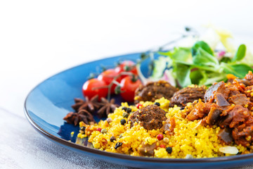 Kofta Tagine Moroccan Meatballs Served With Semolina and Vegetables