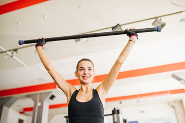 Yes! Beautiful fitness sexy athletic muscular young brunette girl working out training in the gym....