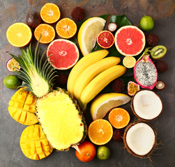 Assortment of exotic fruits on grey table