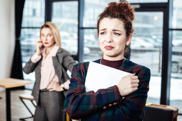 Accountant crying after job interview with strict businesswoman