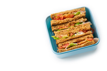 Healthy sandwich with greens, ham, tomatoes and cheese on white background. Lunch ideas for school or for work