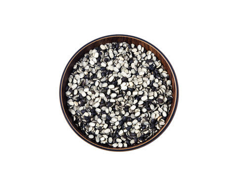 Split Black Lentil Also Know as Black Gram, Black Urad Dal, Vigna Mungo, Urad Bean, Urad Dal, Minapa Pappu, Mungo Bean or Black Matpe Bean Isolated on White Background