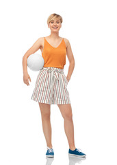 Fototapeta premium sport, leisure and people concept - smiling teenage girl with volleyball over white background
