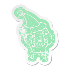 cartoon distressed sticker of a crying bald man wearing santa hat