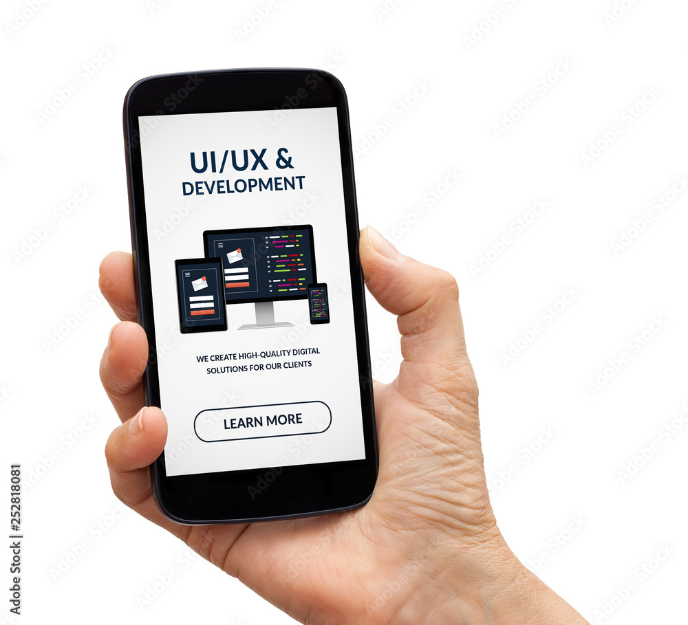 Wall mural hand holding smart phone with ui/ux design and development concept on screen. isolated