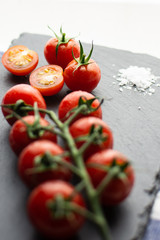 Bunch of cherry tomatoes with salt