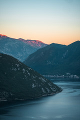 Sunset shot of beautiful mountains and the bay. Beautiful color and atmosphere