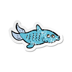 retro distressed sticker of a cartoon fish