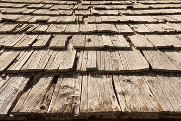Natural pine wood panels from a wooden roof of a mountain stable