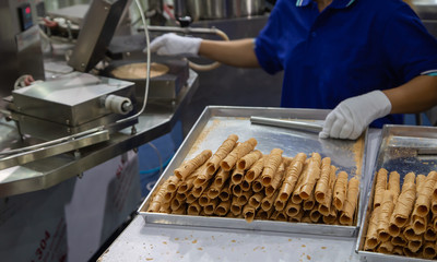 Industrial food worker made coconut crispy roll biscuit