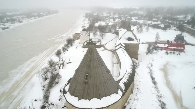 Flying over Old Ladoga fortress misty February morning (aerial video). Staraya Ladoga, Russia