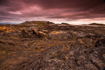 Fototapeta premium The Krafla is volcanic area in Iceland. Amazing lava field and dramatic sky with dark clouds.