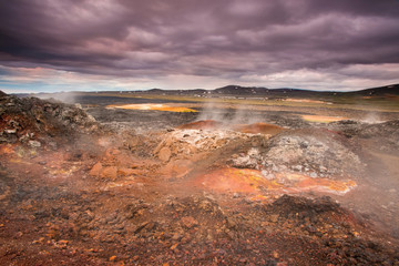 The Krafla is volcanic area in Iceland. Amazing lava field and dramatic sky with dark clouds.