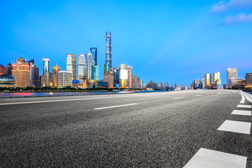 Empty asphalt road through Shanghai business district