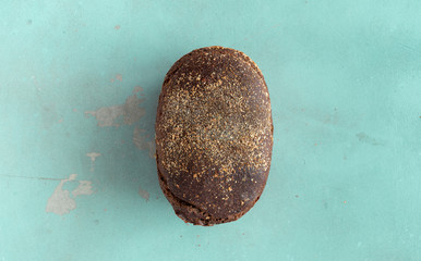 Loaf rye bread crispy stone background top view