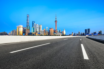 Fototapeta na wymiar Empty asphalt road through Shanghai business district