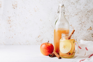 Cool, healthy drink with apple cider vinegar, honey, apples and cinnamon
