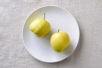 Imperfect ugly misshapen fresh golden apples