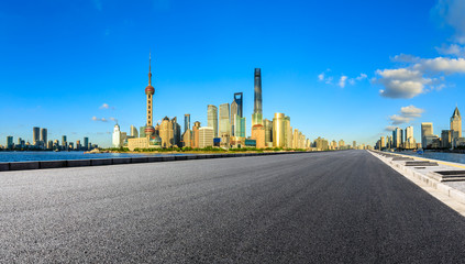 Fototapeta na wymiar Empty asphalt road through Shanghai business district
