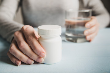Woman drink pills in morning