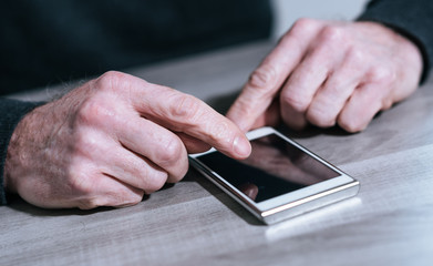 Male hands using a smartphone