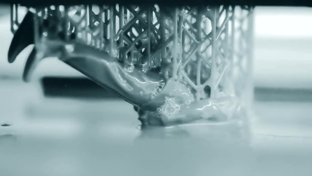 Stereolithography DPL, SLA 3d printer creating shape by UV polymerization.