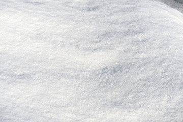 White snow texture on a sunny day. Winter background