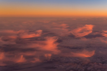 Flight scene plane window view clouds sunset
