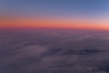 Flight scene plane window view clouds sunset
