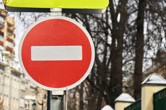 Modern red do not enter road sign with a reflecting surface in Moscow.