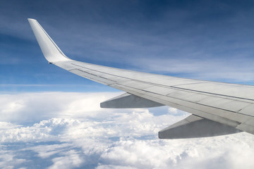 flying and traveling, view from airplane window on the wing