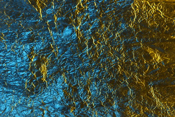 abstract background metal aluminum foil blue and yellow gold color