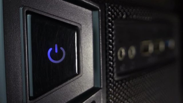 Front panel of the computer with flashing power button
