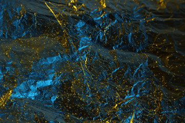 abstract background metal aluminum foil blue and yellow gold color