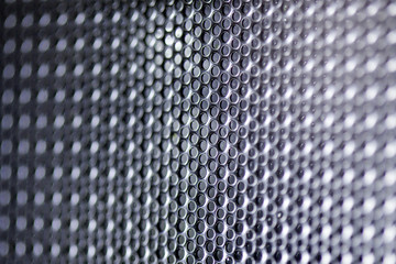 metallic mesh on a blue background. Whole background.