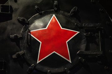Big red star on front of an black historic locomotive