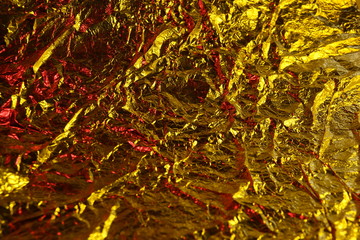 abstract background metal aluminum foil gold yellow and red colors
