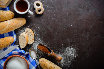 Morning breakfast. Coffee with bread or buns. Sugar, spoon and blue napkin.